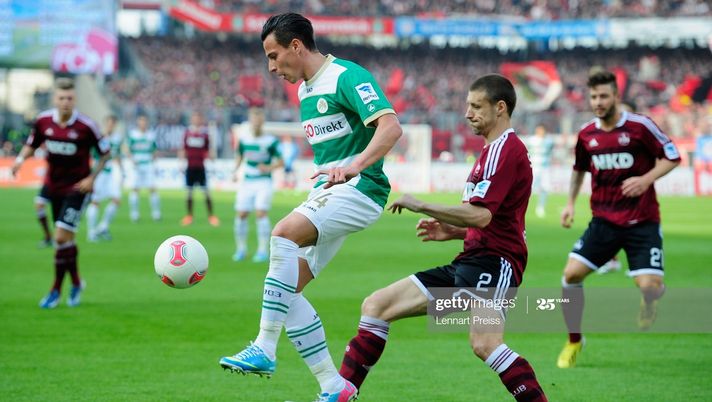 NUREMBERG, GERMANY - APRIL 21:  Timmy Simons (R) of Nuernberg challenges Edgar Prib of Fuerth during the Bundesliga match between 1. FC Nuernberg and SpVgg Greuther Fuerth at Stadium Nuremberg on April 21, 2013 in Nuremberg, Germany.  (Photo by Lennart Preiss/Bongarts/Getty Images) 