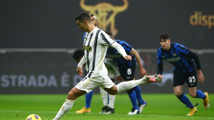 MILAN, ITALY - FEBRUARY 02: Cristiano Ronaldo of Juventus scores their side's first goal from the penalty spot during the Coppa Italia semi-final match between FC Internazionale and Juventus at Stadio Giuseppe Meazza on February 02, 2021 in Milan, Italy. Sporting stadiums around Italy remain under strict restrictions due to the Coronavirus Pandemic as Government social distancing laws prohibit fans inside venues resulting in games being played behind closed doors. (Photo by Marco Luzzani/Getty Images) MILAN, ITALY - FEBRUARY 02: Cristiano Ronaldo of Juventus scores their side's first goal from the penalty spot during the Coppa Italia semi-final match between FC Internazionale and Juventus at Stadio Giuseppe Meazza on February 02, 2021 in Milan, Italy. Sporting stadiums around Italy remain under strict restrictions due to the Coronavirus Pandemic as Government social distancing laws prohibit fans inside venues resulting in games being played behind closed doors. (Photo by Marco Luzzani/Getty Images)
