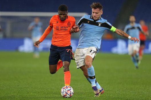 ROME, ITALY - DECEMBER 08: Clinton Mata of Club Brugge challenges for the ball with Ciro Immobile of SS Lazio during the UEFA Champions League Group F stage match between SS Lazio and Club Brugge KV at Stadio Olimpico on December 08, 2020 in Rome, Italy. Sporting stadiums around Italy remain under strict restrictions due to the Coronavirus Pandemic as Government social distancing laws prohibit fans inside venues resulting in games being played behind closed doors. (Photo by Paolo Bruno/Getty Images) ROME, ITALY - DECEMBER 08: Clinton Mata of Club Brugge challenges for the ball with Ciro Immobile of SS Lazio during the UEFA Champions League Group F stage match between SS Lazio and Club Brugge KV at Stadio Olimpico on December 08, 2020 in Rome, Italy. Sporting stadiums around Italy remain under strict restrictions due to the Coronavirus Pandemic as Government social distancing laws prohibit fans inside venues resulting in games being played behind closed doors. (Photo by Paolo Bruno/Getty Images)