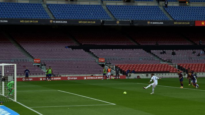 BARCELONA, SPAIN - OCTOBER 24: Sergio Ramos of Real Madrid scores a penalty for his sides second goal from the during the La Liga Santander match between FC Barcelona and Real Madrid at Camp Nou on October 24, 2020 in Barcelona, Spain. Sporting stadiums around Spain remain under strict restrictions due to the Coronavirus Pandemic as Government social distancing laws prohibit fans inside venues resulting in games being played behind closed doors. (Photo by Alex Caparros/Getty Images) BARCELONA, SPAIN - OCTOBER 24: Sergio Ramos of Real Madrid scores a penalty for his sides second goal from the during the La Liga Santander match between FC Barcelona and Real Madrid at Camp Nou on October 24, 2020 in Barcelona, Spain. Sporting stadiums around Spain remain under strict restrictions due to the Coronavirus Pandemic as Government social distancing laws prohibit fans inside venues resulting in games being played behind closed doors. (Photo by Alex Caparros/Getty Images)