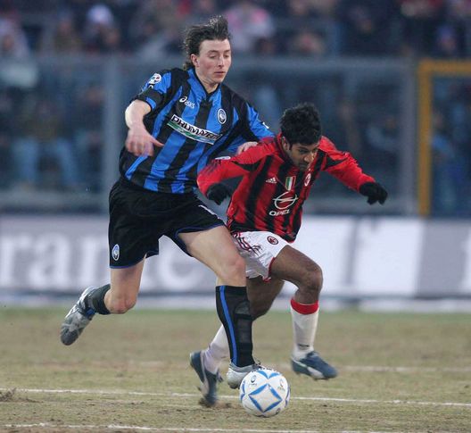 BERGAMO, ITALY - MARCH 5: Milan's Vikash Dhorasoo (R) and Atalanta's Riccardo Montolivo clash during the Serie A match between Atalanta and Milan at Stadio Atleti Azzurri d'Italia, March 5, 2005, in Bergamo, Italy. (Photo by New Press/Getty Images) BERGAMO, ITALY - MARCH 5: Milan's Vikash Dhorasoo (R) and Atalanta's Riccardo Montolivo clash during the Serie A match between Atalanta and Milan at Stadio Atleti Azzurri d'Italia, March 5, 2005, in Bergamo, Italy. (Photo by New Press/Getty Images)
