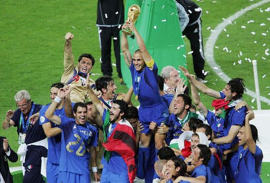 BERLIN - JULY 09: Fabio Cannavaro (C) the captain of Italy lifts the world cup trophy, after his team's victory during the FIFA World Cup Germany 2006 Final match between Italy and France at the Olympic Stadium on July 9, 2006 in Berlin, Germany. (Photo by Mike Hewitt/Getty Images) BERLIN - JULY 09: Fabio Cannavaro (C) the captain of Italy lifts the world cup trophy, after his team's victory during the FIFA World Cup Germany 2006 Final match between Italy and France at the Olympic Stadium on July 9, 2006 in Berlin, Germany. (Photo by Mike Hewitt/Getty Images)