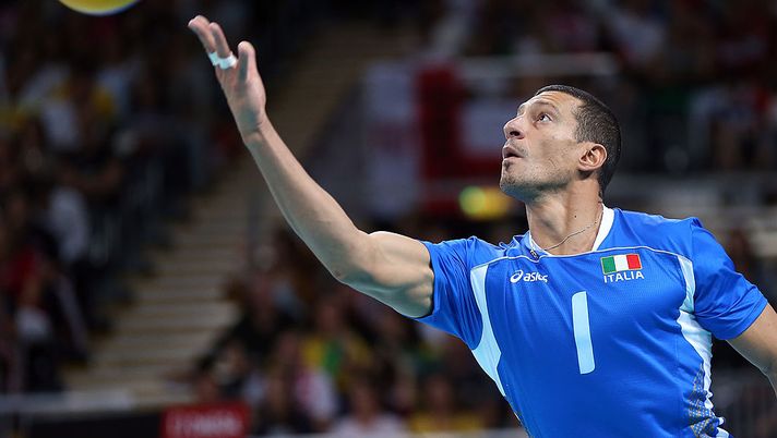 LONDON, ENGLAND - AUGUST 08:  Luigi Mastrangelo #1 of Italy serves the ball in the first set against the United States during the Men's Volleyball quarterfinals on Day 12 of the London 2012 Olympic Games at Earls Court on August 8, 2012 in London, England.  (Photo by Elsa/Getty Images) 