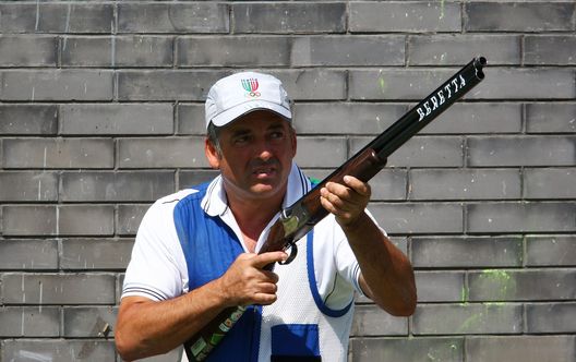 BEIJING - AUGUST 16: Andrea Benelli of Italy competes in the men's skeet shooting qualification event at the Beijing Shooting Range Hall on Day 8 of the Beijing 2008 Olympic Games on August 16, 2008 in Beijing, China. (Photo by Mike Hewitt/Getty Images) BEIJING - AUGUST 16: Andrea Benelli of Italy competes in the men's skeet shooting qualification event at the Beijing Shooting Range Hall on Day 8 of the Beijing 2008 Olympic Games on August 16, 2008 in Beijing, China. (Photo by Mike Hewitt/Getty Images)