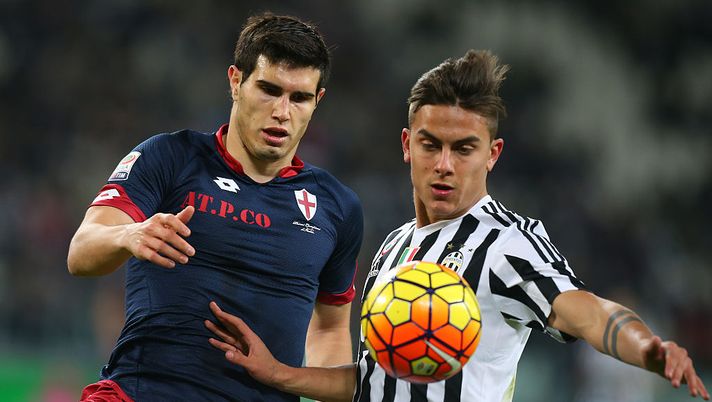 Ezequiel Munoz Genoa's defender from Argentina (L) fights for the ball with Juventus' forward Paulo Dybala from Argentina during the Italian Serie A football match Juventus Vs Genoa on February 3, 2016 at the "Juventus Stadium" in Turin. AFP PHOTO / MARCO BERTORELLO / AFP / MARCO BERTORELLO (Photo credit should read MARCO BERTORELLO/AFP/Getty Images) Muñoz