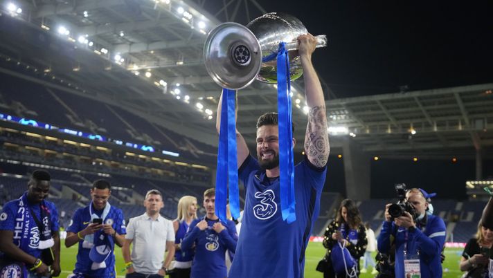 PORTO, PORTUGAL - MAY 29: Olivier Giroud of Chelsea celebrates with the Champions League Trophy following their team's victory in the UEFA Champions League Final between Manchester City and Chelsea FC at Estadio do Dragao on May 29, 2021 in Porto, Portugal. (Photo by Manu Fernandez - Pool/Getty Images) PORTO, PORTUGAL - MAY 29: Olivier Giroud of Chelsea celebrates with the Champions League Trophy following their team's victory in the UEFA Champions League Final between Manchester City and Chelsea FC at Estadio do Dragao on May 29, 2021 in Porto, Portugal. (Photo by Manu Fernandez - Pool/Getty Images)