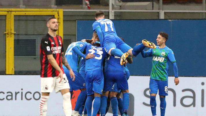 MILAN, ITALY - APRIL 21: Giacomo Raspadori of U.S. Sassuolo Calcio celebrates with team mates after scoring their sides second goal with team mates Domenico Berardi and Maxime Lopez during the Serie A match between AC Milan and US Sassuolo at Stadio Giuseppe Meazza on April 21, 2021 in Milan, Italy.Sporting stadiums around Italy remain under strict restrictions due to the Coronavirus Pandemic as Government social distancing laws prohibit fans inside venues resulting in games being played behind closed doors. (Photo by Marco Luzzani/Getty Images) MILAN, ITALY - APRIL 21: Giacomo Raspadori of U.S. Sassuolo Calcio celebrates with team mates after scoring their sides second goal with team mates Domenico Berardi and Maxime Lopez during the Serie A match between AC Milan and US Sassuolo at Stadio Giuseppe Meazza on April 21, 2021 in Milan, Italy.Sporting stadiums around Italy remain under strict restrictions due to the Coronavirus Pandemic as Government social distancing laws prohibit fans inside venues resulting in games being played behind closed doors. (Photo by Marco Luzzani/Getty Images)