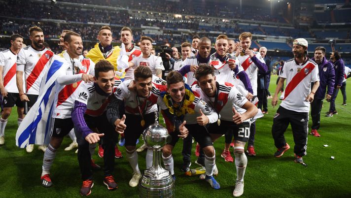 MADRID, SPAIN - DECEMBER 09: The River Plate team celebrate with the Copa Libertadores Trophy following their victory in the second leg of the final match of Copa CONMEBOL Libertadores 2018 between Boca Juniors and River Plate at Estadio Santiago Bernabeu on December 9, 2018 in Madrid, Spain. Due to the violent episodes of November 24th at River Plate stadium, CONMEBOL rescheduled the game and moved it out of Americas for the first time in history. (Photo by Denis Doyle/Getty Images) MADRID, SPAIN - DECEMBER 09: The River Plate team celebrate with the Copa Libertadores Trophy following their victory in the second leg of the final match of Copa CONMEBOL Libertadores 2018 between Boca Juniors and River Plate at Estadio Santiago Bernabeu on December 9, 2018 in Madrid, Spain. Due to the violent episodes of November 24th at River Plate stadium, CONMEBOL rescheduled the game and moved it out of Americas for the first time in history. (Photo by Denis Doyle/Getty Images)