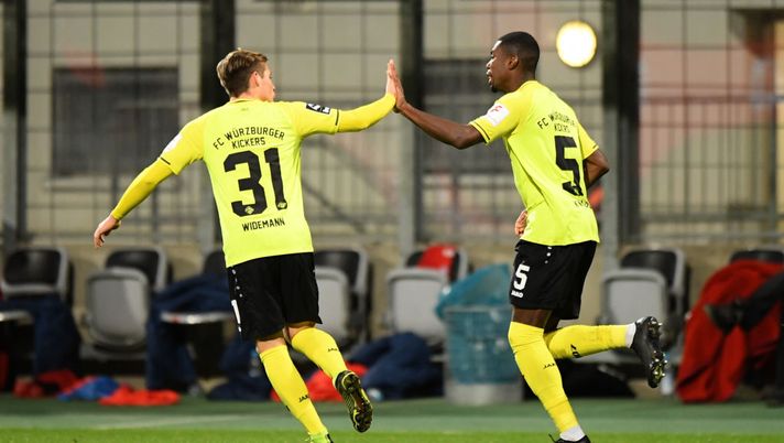 MUNICH, GERMANY - DECEMBER 22: Leroy Kwadwo of Wuerzburger Kickers celebrates with team mate Dominik Widemann after scroring his team's first goal during the 3. Liga match between Bayern Muenchen II and FC Wuerzburger Kickers at Stadion an der Gruenwalder Straße on December 22, 2019 in Munich, Germany. (Photo by Sebastian Widmann/Getty Images for DFB) 