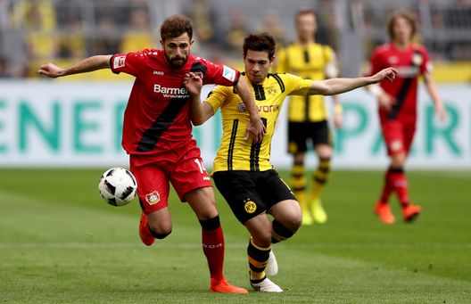  DORTMUND, GERMANY - MARCH 04: Admir Mehmedi of Bayer Leverkusen is challenged by Raphael Guerreiro of Dortmund during the Bundesliga match between Borussia Dortmund and Bayer 04 Leverkusen at Signal Iduna Park on March 4, 2017 in Dortmund, Germany. (Photo by Lars Baron/Bongarts/Getty Images) 