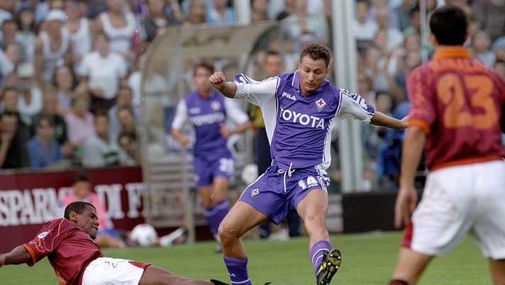 3 Oct 1999:  Aldair of Roma slides in on Sandro Cois of Fiorentina  during the Serie A match at the Artemio Franchi Stadium in Florence, Italy. Roma won 3-1.  Mandatory Credit: Claudio Villa /Allsport 