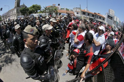 BUENOS AIRES, ARGENTINA - NOVEMBER 25: Riot police stand guard outside of Monumental Stadium of River Plate before the second leg of the final of Copa CONMEBOL Libertadores 2018 between River Plate and Boca Juniors at Estadio Monumental Antonio Vespucio Liberti on November 25, 2018 in Buenos Aires, Argentina. The match was suspended yesterday due to the attacks suffered by players of Boca Juniors on their arrival to the satdium and was rescheduled for today. (Photo by Marcelo Hernandez/Getty Images) BUENOS AIRES, ARGENTINA - NOVEMBER 25: Riot police stand guard outside of Monumental Stadium of River Plate before the second leg of the final of Copa CONMEBOL Libertadores 2018 between River Plate and Boca Juniors at Estadio Monumental Antonio Vespucio Liberti on November 25, 2018 in Buenos Aires, Argentina. The match was suspended yesterday due to the attacks suffered by players of Boca Juniors on their arrival to the satdium and was rescheduled for today. (Photo by Marcelo Hernandez/Getty Images)