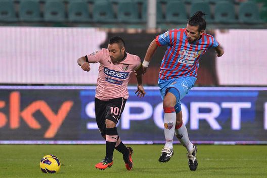 PALERMO, ITALY - NOVEMBER 24: Fabrizio Miccoli (L) of Palermo and Nicolas Spolli of Catania compete for the ball during the Serie A match between US Citta di Palermo and Calcio Catania at Stadio Renzo Barbera on November 24, 2012 in Palermo, Italy. (Photo by Tullio M. Puglia/Getty Images) PALERMO, ITALY - NOVEMBER 24: Fabrizio Miccoli (L) of Palermo and Nicolas Spolli of Catania compete for the ball during the Serie A match between US Citta di Palermo and Calcio Catania at Stadio Renzo Barbera on November 24, 2012 in Palermo, Italy. (Photo by Tullio M. Puglia/Getty Images)