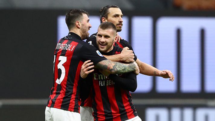 MILAN, ITALY - FEBRUARY 07: Ante Rebic of AC Milan celebrates with team mates (L - R) Alessio Romagnoli and Zlatan Ibrahimovic after scoring their side's third goal during the Serie A match between AC Milan and FC Crotone at Stadio Giuseppe Meazza on February 07, 2021 in Milan, Italy. Sporting stadiums around Italy remain under strict restrictions due to the Coronavirus Pandemic as Government social distancing laws prohibit fans inside venues resulting in games being played behind closed doors. (Photo by Marco Luzzani/Getty Images) MILAN, ITALY - FEBRUARY 07: Ante Rebic of AC Milan celebrates with team mates (L - R) Alessio Romagnoli and Zlatan Ibrahimovic after scoring their side's third goal during the Serie A match between AC Milan and FC Crotone at Stadio Giuseppe Meazza on February 07, 2021 in Milan, Italy. Sporting stadiums around Italy remain under strict restrictions due to the Coronavirus Pandemic as Government social distancing laws prohibit fans inside venues resulting in games being played behind closed doors. (Photo by Marco Luzzani/Getty Images)