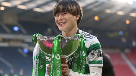 GLASGOW, SCOTLAND - FEBRUARY 26: Kyogo Furuhashi of Celtic celebrates while holding the Viaplay Cup trophy following victory in the Viaplay Cup Final between Rangers and Celtic at Hampden Park on February 26, 2023 in Glasgow, Scotland. (Photo by Ian MacNicol/Getty Images)