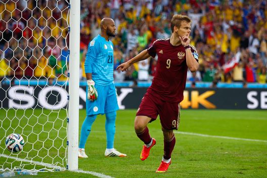 CURITIBA, BRAZIL - JUNE 26: Alexander Kokorin of Russia celebrates scoring his team's first goal past Rais M'Bolhi of Algeria during the 2014 FIFA World Cup Brazil Group H match between Algeria and Russia at Arena da Baixada on June 26, 2014 in Curitiba, Brazil. (Photo by Clive Rose/Getty Images) CURITIBA, BRAZIL - JUNE 26: Alexander Kokorin of Russia celebrates scoring his team's first goal past Rais M'Bolhi of Algeria during the 2014 FIFA World Cup Brazil Group H match between Algeria and Russia at Arena da Baixada on June 26, 2014 in Curitiba, Brazil. (Photo by Clive Rose/Getty Images)