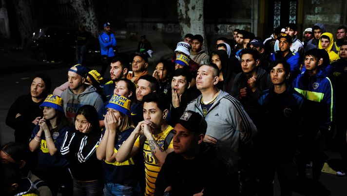 BUENOS AIRES, ARGENTINA - OCTOBER 22: Fans of the Boca Juniors soccer team watch a tense match in Buenos Aires on October 22, 2019 in Buenos Aires, Argentina. Boca Juniors ultimately lost the match to River Plate 2-1. Argentina, a nation rocked by boom and bust economies for decades, is preparing for new presidential elections next Sunday which will see populist-leaning Alberto Fernandez against business-friendly incumbent Mauricio Macri. With a sharp drop in the peso, high unemployment and rising inflation, Argentines are looking for a leader to steer the economy towards stabilization.  (Photo by Spencer Platt/Getty Images) 