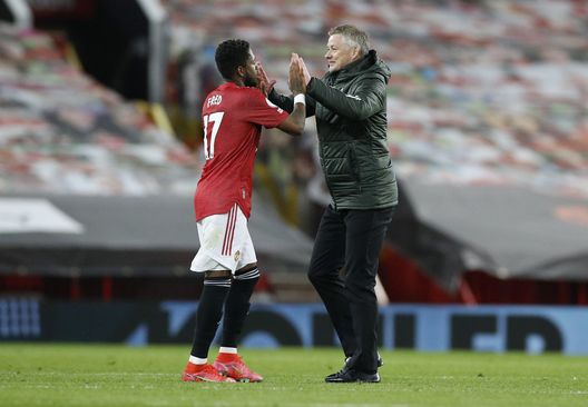 MANCHESTER, ENGLAND - APRIL 04: Ole Gunnar Solskjaer, Manager of Manchester United and Fred of Manchester United celebrate following their side's victory in the Premier League match between Manchester United and Brighton & Hove Albion at Old Trafford on April 04, 2021 in Manchester, England. Sporting stadiums around the UK remain under strict restrictions due to the Coronavirus Pandemic as Government social distancing laws prohibit fans inside venues resulting in games being played behind closed doors. (Photo by Phil Noble - Pool/Getty Images) MANCHESTER, ENGLAND - APRIL 04: Ole Gunnar Solskjaer, Manager of Manchester United and Fred of Manchester United celebrate following their side's victory in the Premier League match between Manchester United and Brighton & Hove Albion at Old Trafford on April 04, 2021 in Manchester, England. Sporting stadiums around the UK remain under strict restrictions due to the Coronavirus Pandemic as Government social distancing laws prohibit fans inside venues resulting in games being played behind closed doors. (Photo by Phil Noble - Pool/Getty Images)