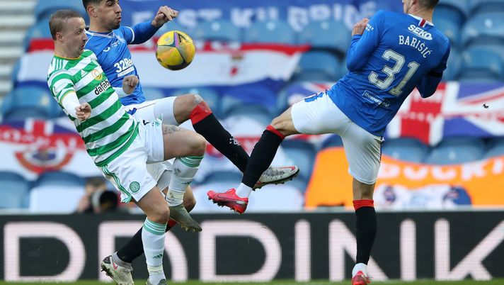 GLASGOW, SCOTLAND - JANUARY 02: Leon Balogun and Borna Barisic of Rangers and Leigh Griffiths of Celtic battle for possession during the Ladbrokes Scottish Premiership match between Rangers and Celtic at Ibrox Stadium on January 02, 2021 in Glasgow, Scotland. The match will be played without fans, behind closed doors as a Covid-19 precaution. (Photo by Ian MacNicol/Getty Images) GLASGOW, SCOTLAND - JANUARY 02: Leon Balogun and Borna Barisic of Rangers and Leigh Griffiths of Celtic battle for possession during the Ladbrokes Scottish Premiership match between Rangers and Celtic at Ibrox Stadium on January 02, 2021 in Glasgow, Scotland. The match will be played without fans, behind closed doors as a Covid-19 precaution. (Photo by Ian MacNicol/Getty Images)