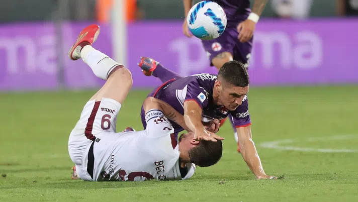 FLORENCE, ITALY - AUGUST 28: Nikola Milenkovic of ACF Fiorentina battles for the ball with Andrea Belotti of Torino FC during the Serie A match between ACF Fiorentina and Torino FC at Stadio Artemio Franchi on August 28, 2021 in Florence, Italy.  (Photo by Gabriele Maltinti/Getty Images)