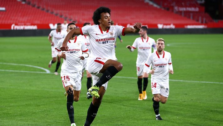 SEVILLE, SPAIN - FEBRUARY 10: Jules Kounde of Sevilla celebrates after scoring their side's first goal during the Copa del Rey Semi Final First Leg match between Sevilla and FC Barcelona at Estadio Ramon Sanchez Pizjuan on February 10, 2021 in Seville, Spain. Sporting stadiums around Spain remain under strict restrictions due to the Coronavirus Pandemic as Government social distancing laws prohibit fans inside venues resulting in games being played behind closed doors. (Photo by Fran Santiago/Getty Images) SEVILLE, SPAIN - FEBRUARY 10: Jules Kounde of Sevilla celebrates after scoring their side's first goal during the Copa del Rey Semi Final First Leg match between Sevilla and FC Barcelona at Estadio Ramon Sanchez Pizjuan on February 10, 2021 in Seville, Spain. Sporting stadiums around Spain remain under strict restrictions due to the Coronavirus Pandemic as Government social distancing laws prohibit fans inside venues resulting in games being played behind closed doors. (Photo by Fran Santiago/Getty Images)