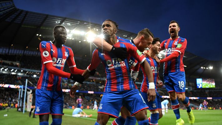 MANCHESTER, ENGLAND - JANUARY 18: Wilfried Zaha of Crystal Palace celebrates with team mates after Palace's 2nd goal during the Premier League match between Manchester City and Crystal Palace at Etihad Stadium on January 18, 2020 in Manchester, United Kingdom. (Photo by Michael Regan/Getty Images) MANCHESTER, ENGLAND - JANUARY 18: Wilfried Zaha of Crystal Palace celebrates with team mates after Palace's 2nd goal during the Premier League match between Manchester City and Crystal Palace at Etihad Stadium on January 18, 2020 in Manchester, United Kingdom. (Photo by Michael Regan/Getty Images)