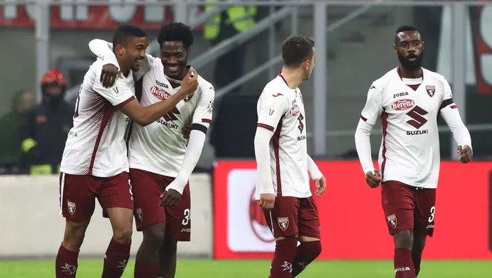 MILAN, ITALY - JANUARY 28:  Gleison Bremer (L) of Torino FC celebrates his second goal with his team-mate Ola Aina during the Coppa Italia Quarter Final match between AC Milan and Torino at San Siro on January 28, 2020 in Milan, Italy.  (Photo by Marco Luzzani/Getty Images)