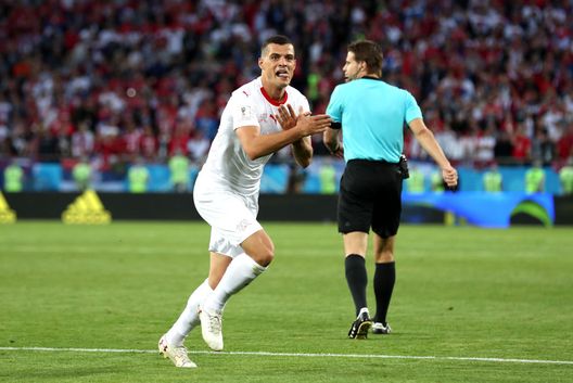KALININGRAD, RUSSIA - JUNE 22: Granit Xhaka of Switzerland celebrates after scoring his team's first goal during the 2018 FIFA World Cup Russia group E match between Serbia and Switzerland at Kaliningrad Stadium on June 22, 2018 in Kaliningrad, Russia. (Photo by Clive Rose/Getty Images)Lewandowski KALININGRAD, RUSSIA - JUNE 22: Granit Xhaka of Switzerland celebrates after scoring his team's first goal during the 2018 FIFA World Cup Russia group E match between Serbia and Switzerland at Kaliningrad Stadium on June 22, 2018 in Kaliningrad, Russia. (Photo by Clive Rose/Getty Images)Lewandowski
