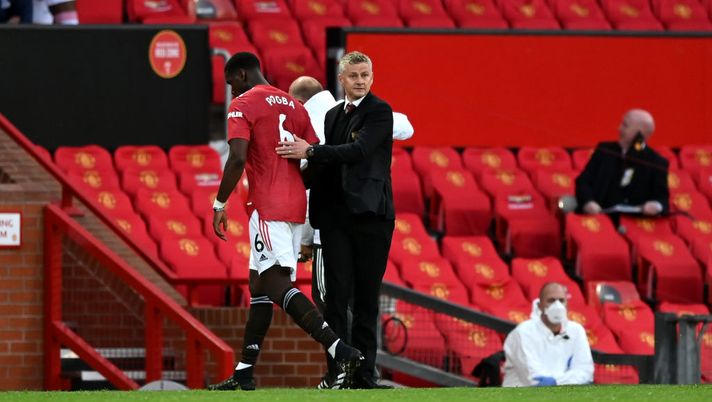 MANCHESTER, ENGLAND - SEPTEMBER 19: Ole Gunnar Solskjaer, Manager of Manchester United greets Paul Pogba of Manchester United as he is substituted off during the Premier League match between Manchester United and Crystal Palace at Old Trafford on September 19, 2020 in Manchester, England. (Photo by Shaun Botterill/Getty Images) MANCHESTER, ENGLAND - SEPTEMBER 19: Ole Gunnar Solskjaer, Manager of Manchester United greets Paul Pogba of Manchester United as he is substituted off during the Premier League match between Manchester United and Crystal Palace at Old Trafford on September 19, 2020 in Manchester, England. (Photo by Shaun Botterill/Getty Images)