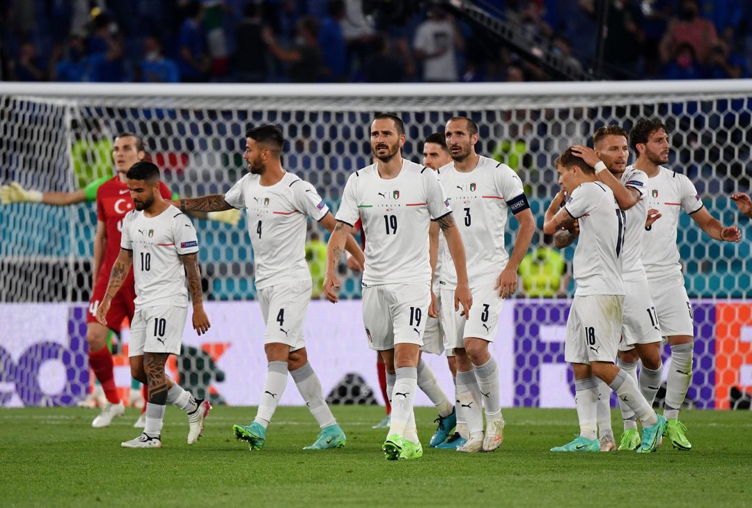  ROME, ITALY - JUNE 11: Leonardo Bonucci of Italy celebrates with team mates after their side's first goal, an own goal scored by Merih Demiral (Not pictured) of Turkey during the UEFA Euro 2020 Championship Group A match between Turkey and Italy at the Stadio Olimpico on June 11, 2021 in Rome, Italy. (Photo by Filippo Monteforte - Pool/Getty Images) 