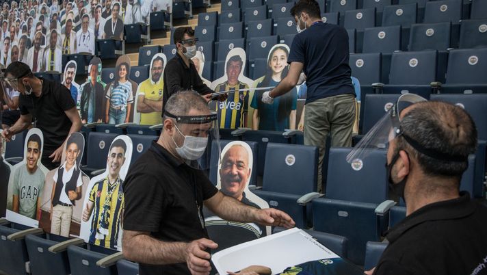 ISTANBUL, TURKEY - JUNE 10: Workers install cut-out portraits of Fenerbahce SK fans at Fenerbahce Sukru Saracoglu Stadium on June 10, 2020 in Istanbul, Turkey. Fenerbahce SK will play Kayserispor in an empty stadium on Friday June 12, in the first Turkish Super League match since the Turkish Football League was cancelled on March 20th due to the coronavirus outbreak. As infection rates of the coronavirus continue to drop and after more than a month of weekend lockdowns, Turkey has begun reopening procedures, allowing bars, restaurants, cafes and some sporting events to begin operations under new restrictions. Limited domestic flights have restarted and the stay-at-home curfew for citizens under 20 and over 65 has been lifted. (Photo by Chris McGrath/Getty Images) ISTANBUL, TURKEY - JUNE 10: Workers install cut-out portraits of Fenerbahce SK fans at Fenerbahce Sukru Saracoglu Stadium on June 10, 2020 in Istanbul, Turkey. Fenerbahce SK will play Kayserispor in an empty stadium on Friday June 12, in the first Turkish Super League match since the Turkish Football League was cancelled on March 20th due to the coronavirus outbreak. As infection rates of the coronavirus continue to drop and after more than a month of weekend lockdowns, Turkey has begun reopening procedures, allowing bars, restaurants, cafes and some sporting events to begin operations under new restrictions. Limited domestic flights have restarted and the stay-at-home curfew for citizens under 20 and over 65 has been lifted. (Photo by Chris McGrath/Getty Images)
