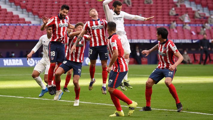 MADRID, SPAIN - MARCH 07: Nacho of Real Madrid jumps to challenge for a header which later results in a VAR check for a potential handball during the La Liga Santander match between Atletico de Madrid and Real Madrid at Estadio Wanda Metropolitano on March 07, 2021 in Madrid, Spain. Sporting stadiums around Spain remain under strict restrictions due to the Coronavirus Pandemic as Government social distancing laws prohibit fans inside venues resulting in games being played behind closed doors. (Photo by Denis Doyle/Getty Images) MADRID, SPAIN - MARCH 07: Nacho of Real Madrid jumps to challenge for a header which later results in a VAR check for a potential handball during the La Liga Santander match between Atletico de Madrid and Real Madrid at Estadio Wanda Metropolitano on March 07, 2021 in Madrid, Spain. Sporting stadiums around Spain remain under strict restrictions due to the Coronavirus Pandemic as Government social distancing laws prohibit fans inside venues resulting in games being played behind closed doors. (Photo by Denis Doyle/Getty Images)