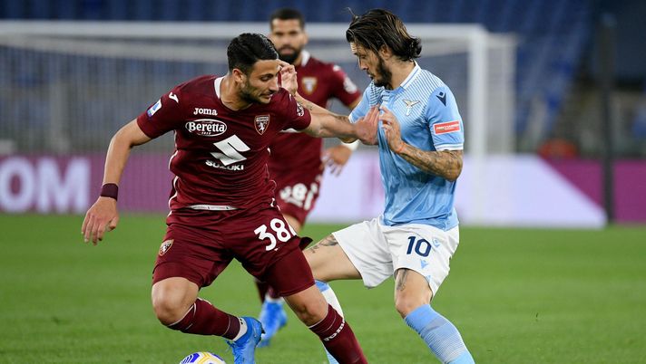 ROME, ITALY - MAY 18: Luis Alberto of SS Lazio competes for the ball with Rolando Mandragora of Torino FC during the Serie A match between SS Lazio and Torino FC at Stadio Olimpico on May 18, 2021 in Rome, Italy. The match, despite it's not postponed by Lega Serie A, will not be played as Torino team need to observe a home quarantine until midnight on Tuesday due to Covd-19. (Photo by Marco Rosi - SS Lazio/Getty Images) ROME, ITALY - MAY 18: Luis Alberto of SS Lazio competes for the ball with Rolando Mandragora of Torino FC during the Serie A match between SS Lazio and Torino FC at Stadio Olimpico on May 18, 2021 in Rome, Italy. The match, despite it's not postponed by Lega Serie A, will not be played as Torino team need to observe a home quarantine until midnight on Tuesday due to Covd-19. (Photo by Marco Rosi - SS Lazio/Getty Images)
