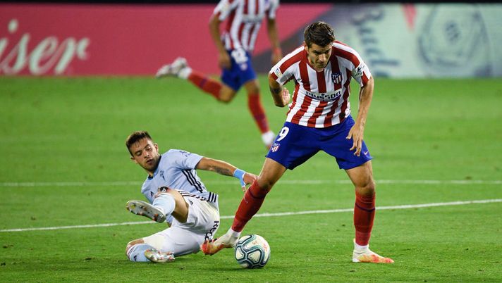 VIGO, SPAIN - JULY 07: Alvaro Morata of Atletico de Madrid competes for the ball with Fran Beltran of RC Celta de Vigo during the Liga match between RC Celta de Vigo and Club Atletico de Madrid at Abanca-Balaídos on July 07, 2020 in Vigo, Spain. Football Stadiums around Europe remain empty due to the Coronavirus Pandemic as Government social distancing laws prohibit fans inside venues resulting in all fixtures being played behind closed doors. (Photo by Octavio Passos/Getty Images) 
