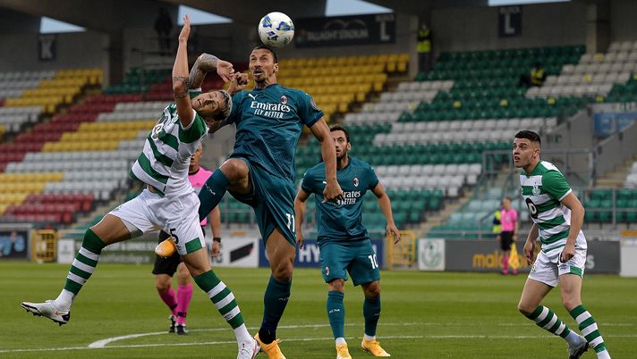 TALLAGHT, IRELAND - SEPTEMBER 17: Zlatan Ibrahimovic of AC Milan competes for a header with Lee Grace of Shamrock Rovers during the UEFA Europa League second qualifying round match between Shamrock Rovers and AC Milan at Tallaght Stadium on September 17, 2020 in Tallaght, Ireland. (Photo by Charles McQuillan/Getty Images) TALLAGHT, IRELAND - SEPTEMBER 17: Zlatan Ibrahimovic of AC Milan competes for a header with Lee Grace of Shamrock Rovers during the UEFA Europa League second qualifying round match between Shamrock Rovers and AC Milan at Tallaght Stadium on September 17, 2020 in Tallaght, Ireland. (Photo by Charles McQuillan/Getty Images)