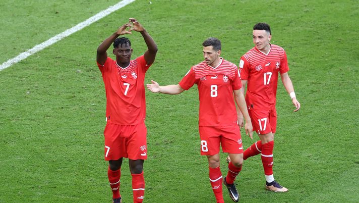 AL WAKRAH, QATAR - NOVEMBER 24: Breel Embolo (L) of Switzerland celebrates scoring their first goal with their teammates Ruben Vargas (R) and Remo Freuler (C) during the FIFA World Cup Qatar 2022 Group G match between Switzerland and Cameroon at Al Janoub Stadium on November 24, 2022 in Al Wakrah, Qatar. (Photo by Alex Grimm/Getty Images) Embolo: “Mi sento svizzero al 60-70% gioco con il 36 perché era la linea che mi portava agli allenamenti” - immagine 1