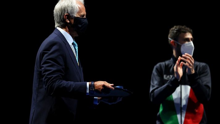 CHIBA, JAPAN - JULY 24: Medal bearer Giovanni Malago of Italy carries the gold medal during the men’s sabre individual medal ceremony of the fencing on day one of the Tokyo 2020 Olympic Games at Makuhari Messe Hall on July 24, 2021 in Chiba, Japan. (Photo by Elsa/Getty Images) 