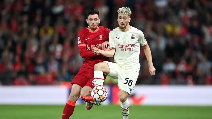 LIVERPOOL, ENGLAND - SEPTEMBER 15: Alexis Saelemaekers of AC Milan is challenged by Andrew Robertson of Liverpool during the UEFA Champions League group B match between Liverpool FC and AC Milan at Anfield on September 15, 2021 in Liverpool, England. (Photo by Shaun Botterill/Getty Images)