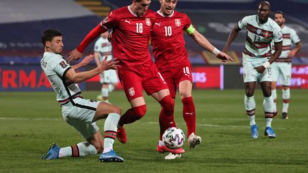 BELGRADE, SERBIA - MARCH 27:  Ruben Dias of Portugal and Dušan Vlahovic  and Dusan Tadic of Serbia  battle for the ball  during the FIFA World Cup 2022 Qatar qualifying match between Serbia and Portugal at FK Crvena Zvezda stadium on March 27, 2021 in Belgrade, Serbia. Sporting stadiums around Serbia remain under strict restrictions due to the Coronavirus Pandemic as Government social distancing laws prohibit fans inside venues resulting in games being played behind closed doors.  (Photo by Srdjan Stevanovic/Getty Images)