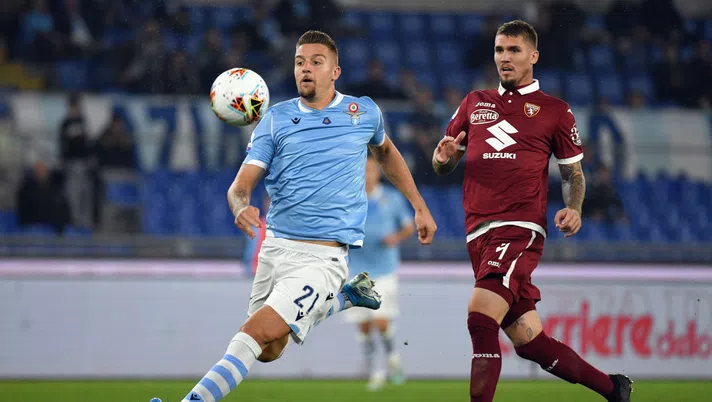 ROME, ITALY - OCTOBER 30:  Sergej Milinkovic Savic of SS Lazio kicks the ball against Evangelista Lyanco during the Serie A match between SS Lazio and Torino FC at Stadio Olimpico on October 30, 2019 in Rome, Italy.  (Photo by Marco Rosi/Getty Images)