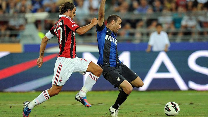 BARI, ITALY - JULY 21: Luca Antonini (L) of Milan looks to make a challenge on Rodrigo Palacio of Inter during the match between FC Internazionale Milano and AC Milan as part of the TIM preseason tournament at Stadio San Nicola on July 21, 2012 in Bari, Italy. (Photo by Giuseppe Bellini/Getty Images) BARI, ITALY - JULY 21: Luca Antonini (L) of Milan looks to make a challenge on Rodrigo Palacio of Inter during the match between FC Internazionale Milano and AC Milan as part of the TIM preseason tournament at Stadio San Nicola on July 21, 2012 in Bari, Italy. (Photo by Giuseppe Bellini/Getty Images)