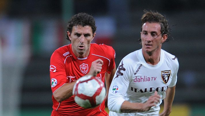 TRIESTE, ITALY - OCTOBER 31:  Denis Godeas of US Triestina Calcio competes with Aimo Stefano Diana of Toeino FC during the Serie B match US Triestina Calcio and Torino FC at Stadio Nereo Rocco on October 31, 2009 in Trieste, Italy.  (Photo by Dino Panato/Getty Images) 