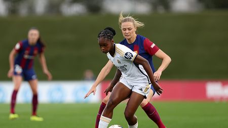MADRID, SPAIN - MARCH 24: Linda Caicedo of Real Madrid on the ball whilst under pressure from Fridolina Rolfo of FC Barcelona during the Liga F match between Real Madrid and FC Barcelona at Estadio Alfredo Di Stefano on March 24, 2024 in Madrid, Spain. (Photo by Florencia Tan Jun/Getty Images)