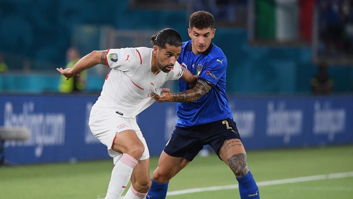 ROME, ITALY - JUNE 16: Ricardo Rodriguez of Switzerland is challenged by Giovanni Di Lorenzo of Italy during the UEFA Euro 2020 Championship Group A match between Italy and Switzerland at Olimpico Stadium on June 16, 2021 in Rome, Italy. (Photo by Alberto Lingria - Pool/Getty Images) ROME, ITALY - JUNE 16: Ricardo Rodriguez of Switzerland is challenged by Giovanni Di Lorenzo of Italy during the UEFA Euro 2020 Championship Group A match between Italy and Switzerland at Olimpico Stadium on June 16, 2021 in Rome, Italy. (Photo by Alberto Lingria - Pool/Getty Images)