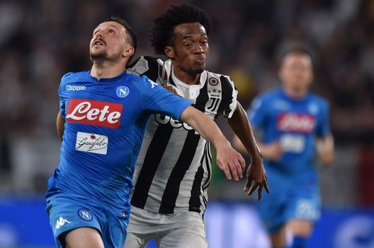 TURIN, ITALY - APRIL 22: Juan Cuadrado of Juventus competes for the ball with Mario Rui of SSC Napoli during the serie A match between Juventus and SSC Napoli on April 22, 2018 in Turin, Italy. (Photo by Tullio Puglia - Juventus/Juventus FC via Getty Images) TURIN, ITALY - APRIL 22: Juan Cuadrado of Juventus competes for the ball with Mario Rui of SSC Napoli during the serie A match between Juventus and SSC Napoli on April 22, 2018 in Turin, Italy. (Photo by Tullio Puglia - Juventus/Juventus FC via Getty Images)