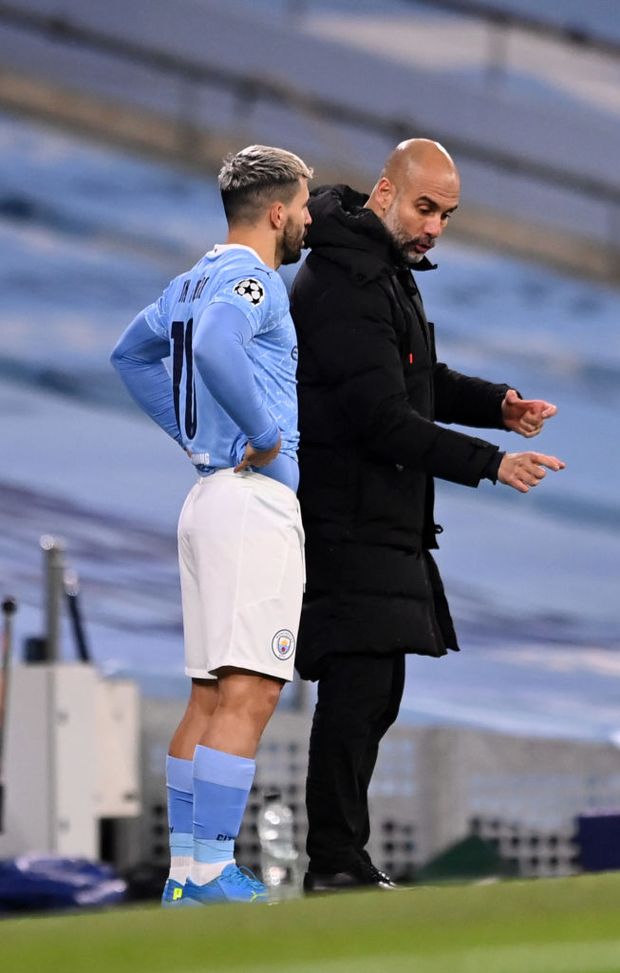 MANCHESTER, ENGLAND - DECEMBER 09: Pep Guardiola, Manager of Manchester City interacts with Sergio Aguero of Manchester City as he prepares to enter the pitch during the UEFA Champions League Group C stage match between Manchester City and Olympique de Marseille at Etihad Stadium on December 09, 2020 in Manchester, England. The match will be played without fans, behind closed doors as a Covid-19 precaution. (Photo by Laurence Griffiths/Getty Images) MANCHESTER, ENGLAND - DECEMBER 09: Pep Guardiola, Manager of Manchester City interacts with Sergio Aguero of Manchester City as he prepares to enter the pitch during the UEFA Champions League Group C stage match between Manchester City and Olympique de Marseille at Etihad Stadium on December 09, 2020 in Manchester, England. The match will be played without fans, behind closed doors as a Covid-19 precaution. (Photo by Laurence Griffiths/Getty Images)