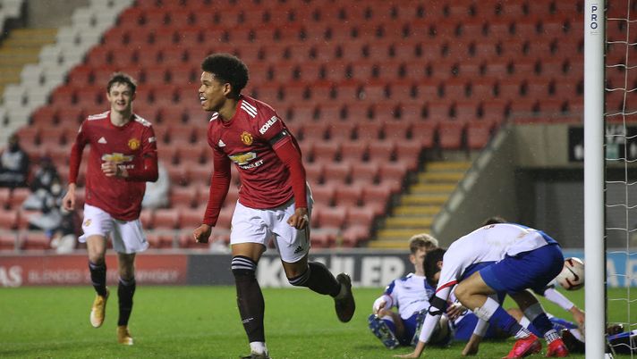 LEIGH, ENGLAND - FEBRUARY 05: Shola Shoretire of Manchester United U23s celebrates scoring their fifth goal during the Premier League 2 match between Manchester United U23s and Blackburn Rovers U23s at Leigh Sports Village on February 05, 2021 in Leigh, England. (Photo by John Peters/Manchester United via Getty Images) LEIGH, ENGLAND - FEBRUARY 05: Shola Shoretire of Manchester United U23s celebrates scoring their fifth goal during the Premier League 2 match between Manchester United U23s and Blackburn Rovers U23s at Leigh Sports Village on February 05, 2021 in Leigh, England. (Photo by John Peters/Manchester United via Getty Images)