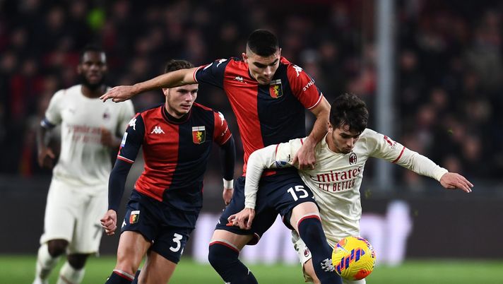 GENOA, ITALY - DECEMBER 01: Brahim Diaz of AC Milan competes for the ball with Johan Vasquez of Genoa CFC during the Serie A match between Genoa CFC and AC Milan at Stadio Luigi Ferraris on December 01, 2021 in Genoa, Italy. (Photo by Claudio Villa/AC Milan via Getty Images)