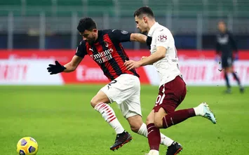  MILAN, ITALY - JANUARY 12: Mateo Musacchio of Milan is challenged by Amer Gojak of Torino during the Coppa Italia match between AC Milan and Torino FC at Stadio Giuseppe Meazza on January 12, 2021 in Milan, Italy. Sporting stadiums around Italy remain under strict restrictions due to the Coronavirus Pandemic as Government social distancing laws prohibit fans inside venues resulting in games being played behind closed doors. (Photo by Marco Luzzani/Getty Images)