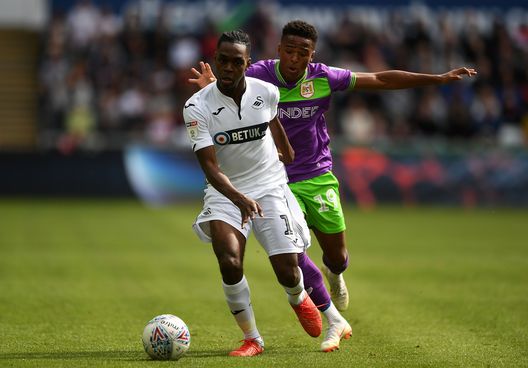  SWANSEA, WALES - AUGUST 25: Joel Asoro of Swansea City is tackled by Niclas Eliasson of Bristol City during the Sky Bet Championship match between Swansea City and Bristol City at the Liberty Stadium on August 25, 2018 in Swansea, Wales. (Photo by Harry Trump/Getty Images) 